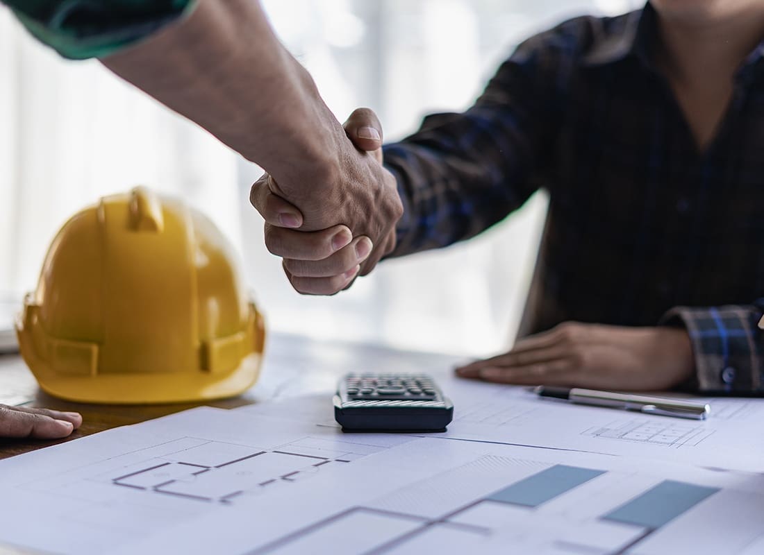 Business Insurance - Contractors Shaking Hands After a Meeting